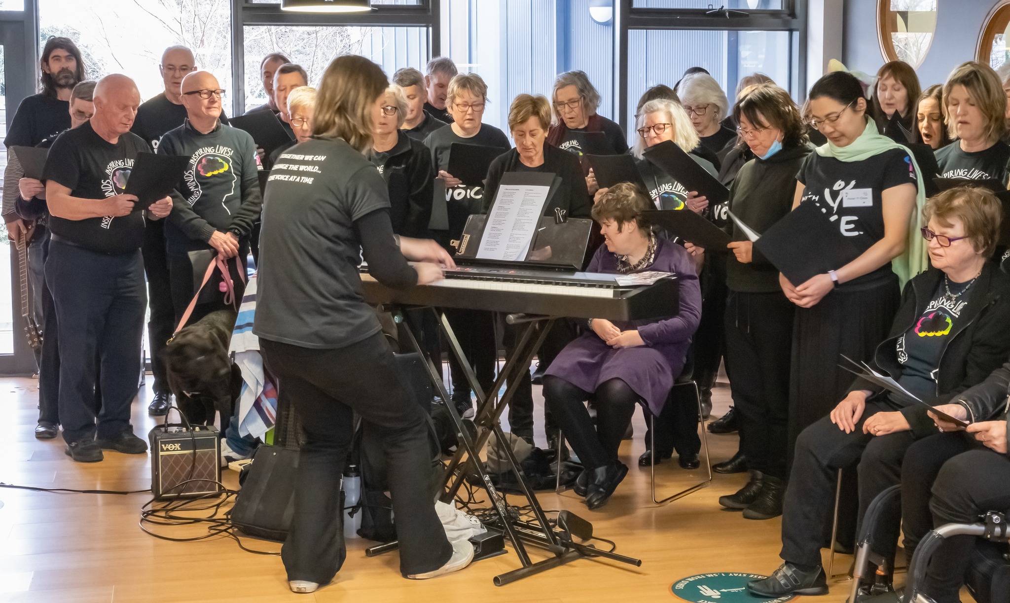 Ashburton community choir performing with conductor