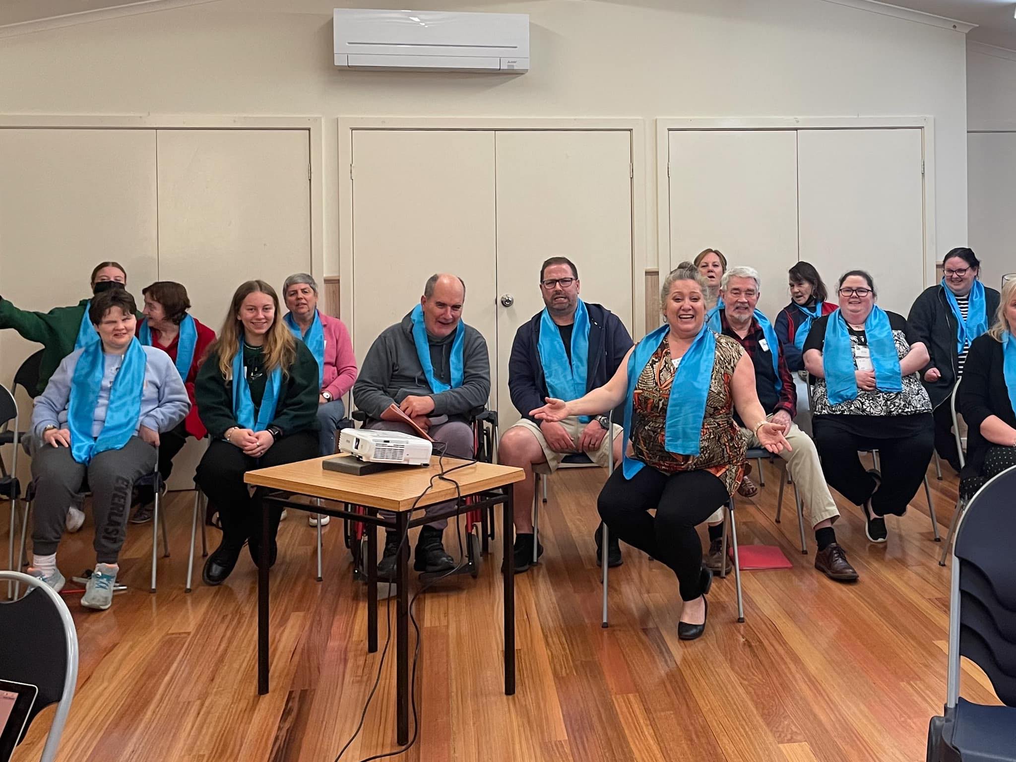 Bayswater community choir members and conductor smiling